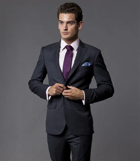 charcoal suit purple tie.